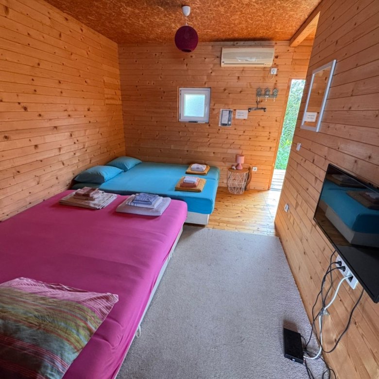 Charming Ulcinj retreat: cozy wooden room, twin beds, A/C, TV. Ideal Montenegro real estate by ekosphere doo&mdash;great investment!.