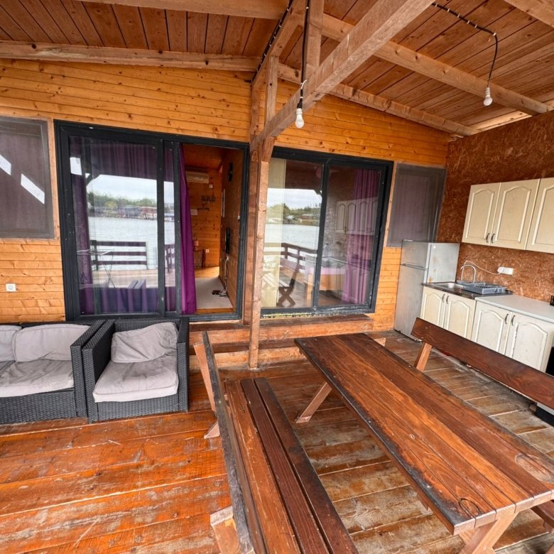 Stunning covered patio in Ulcinj with water views, modern kitchenette, stylish outdoor seating&mdash;ideal Montenegro investment. Eksosphere doo.