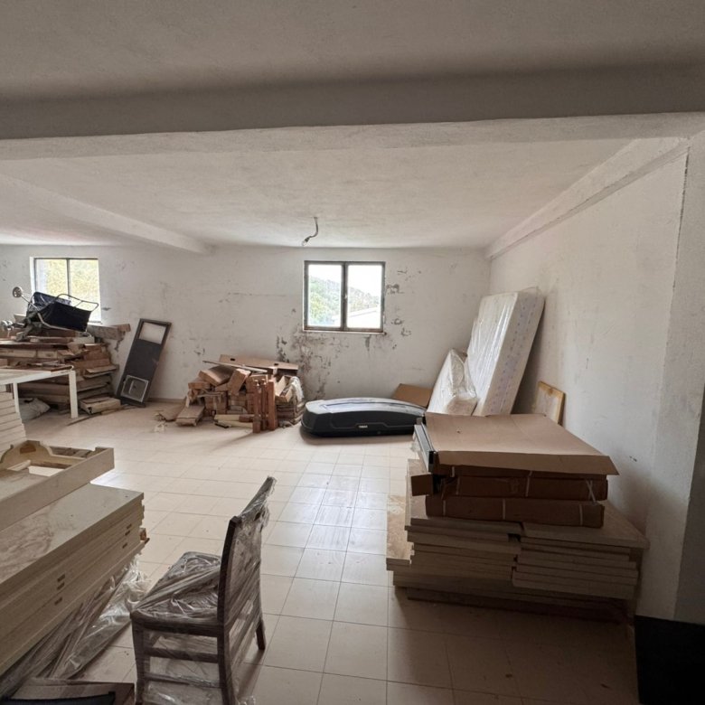 Bright room with white walls, tiled floors, large windows, renovation potential&mdash;ideal Ulcinj investment on immorenta.me by ekosphere doo.