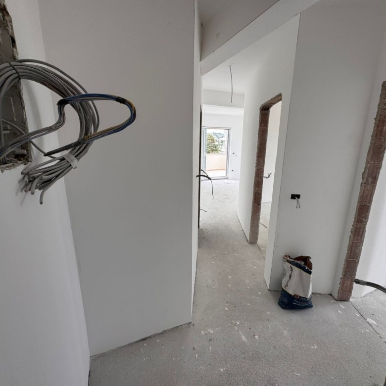 Bright hallway in a prime Ulcinj, Montenegro property; unfinished build&mdash;ideal real estate investment. On immorenta.me by ekosphere doo.