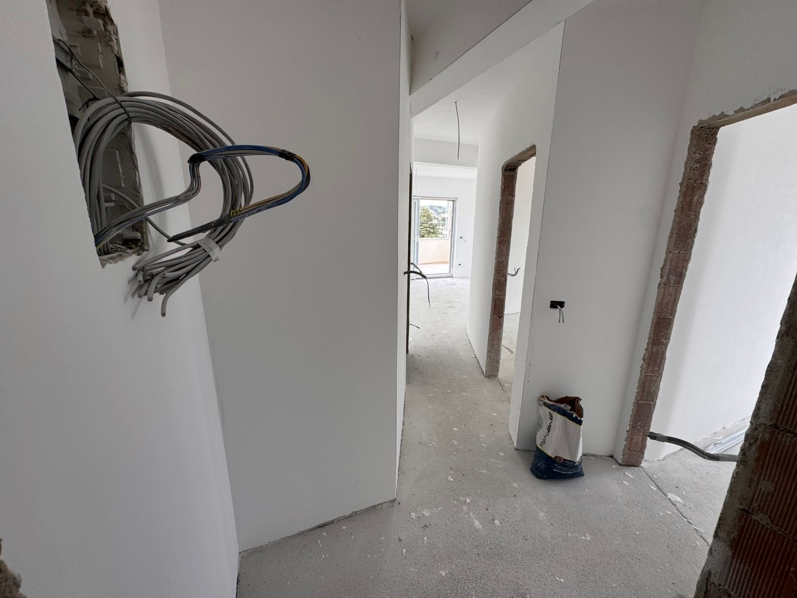 Bright hallway in a prime Ulcinj, Montenegro property; unfinished build&mdash;ideal real estate investment. On immorenta.me by ekosphere doo.