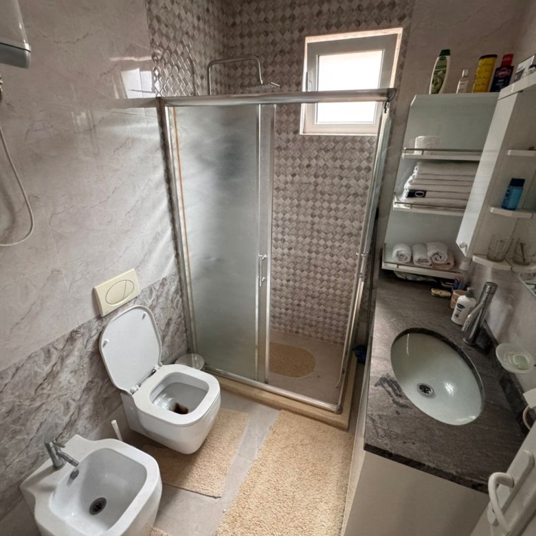 Elegant Ulcinj bathroom with marble walls, glass shower, luxury fittings&mdash;exclusive property via immorenta.me by ekosphere doo.