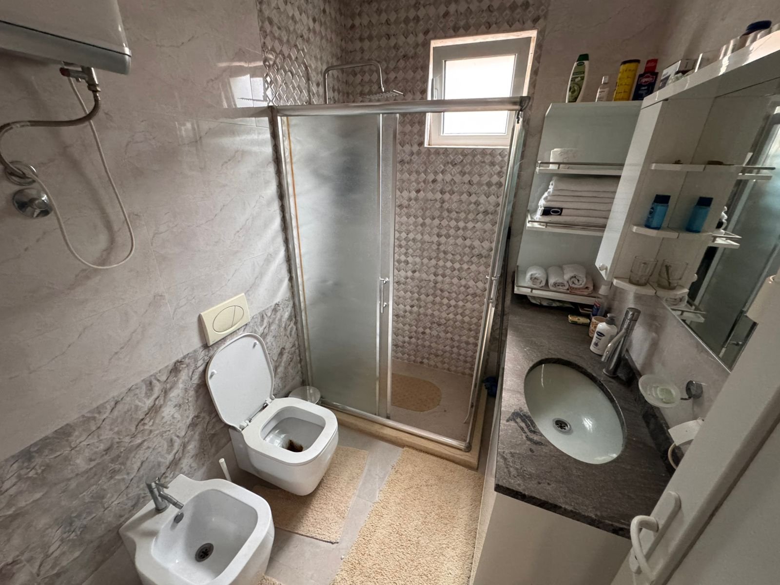 Elegant Ulcinj bathroom with marble walls, glass shower, luxury fittings&mdash;exclusive property via immorenta.me by ekosphere doo.