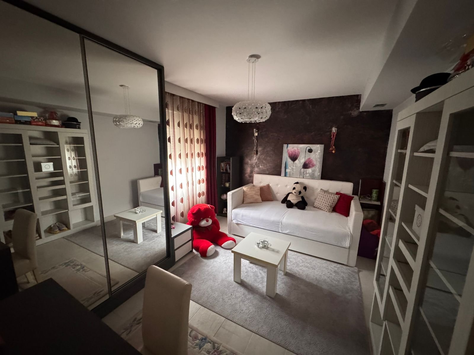 Stylish Ulcinj apartment: bright room, white sofa, mirrored closets, bookshelves&mdash;ideal Montenegro investment from ekosphere doo.