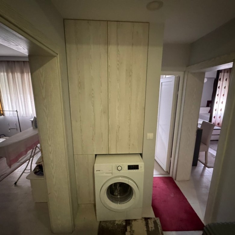 Well-maintained tiled hallway with built-in storage and laundry area, leading to bedrooms&mdash;ideal Ulcinj investment via immorenta.me.