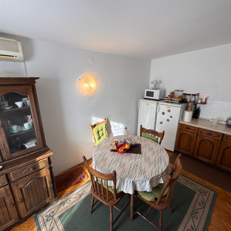 Bright Ulcinj kitchen&mdash;round table, 4 chairs, modern appliances, storage, AC&mdash;prime investment via immorenta.me by ekosphere doo.