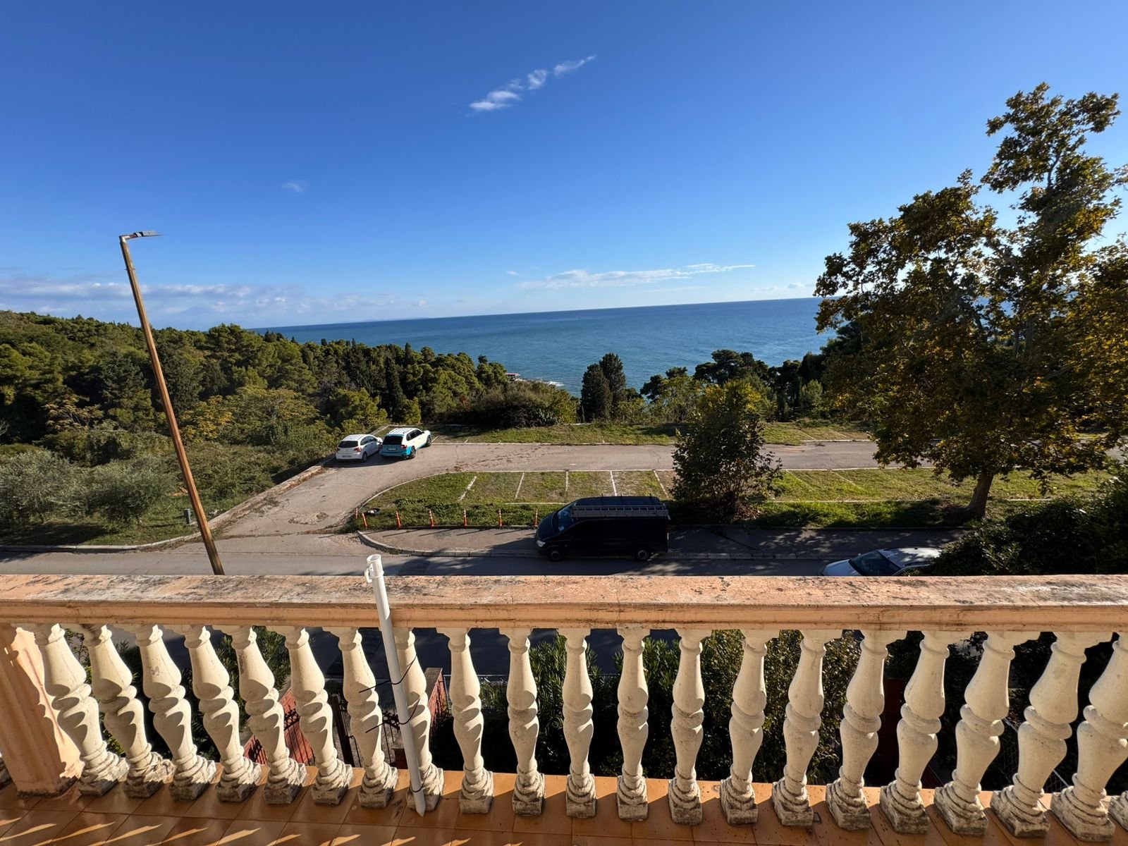 Stunning Ulcinj balcony view with classic white balusters, sea panorama, and Mediterranean scenery&mdash;exclusive at immorenta.me by ekosphere doo.