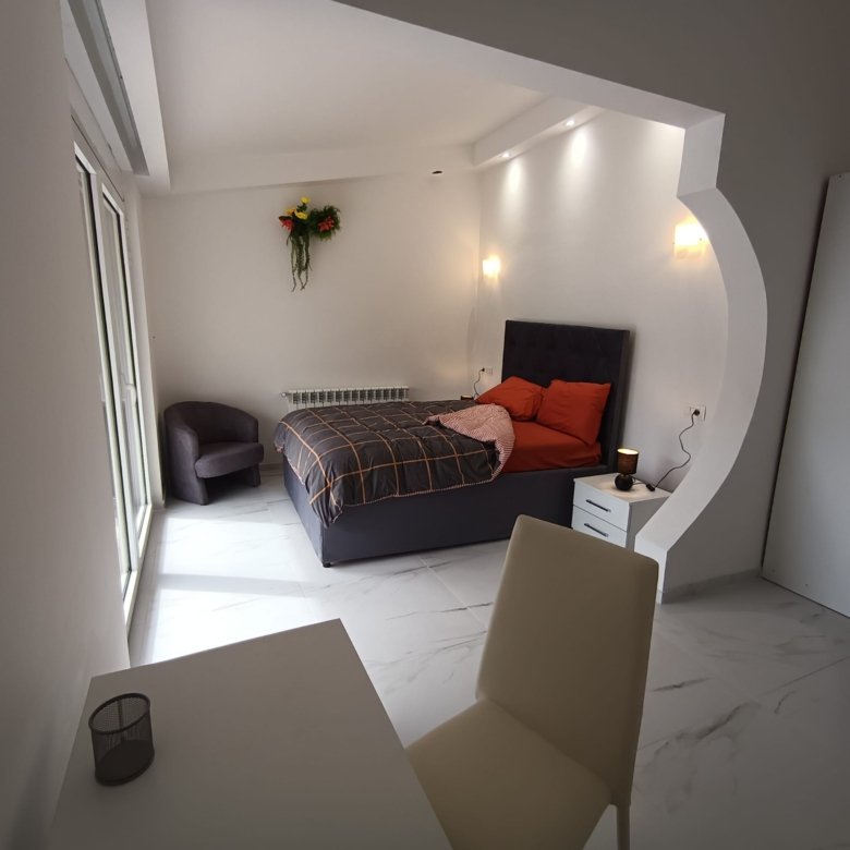 Stunning minimalist bedroom in Ulcinj with marble floors, large windows, premium finishes&mdash;ideal Montenegro investment by ekosphere doo.