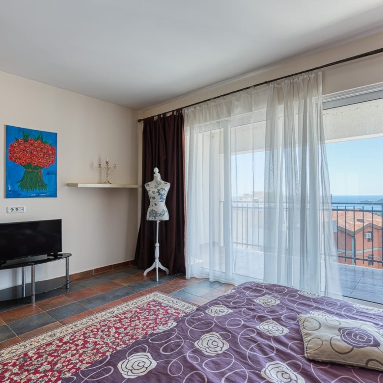 Stunning Ulcinj bedroom with sea-view balcony, modern decor, tiled floors. Exclusive investment at immorenta.me by ekosphere doo.