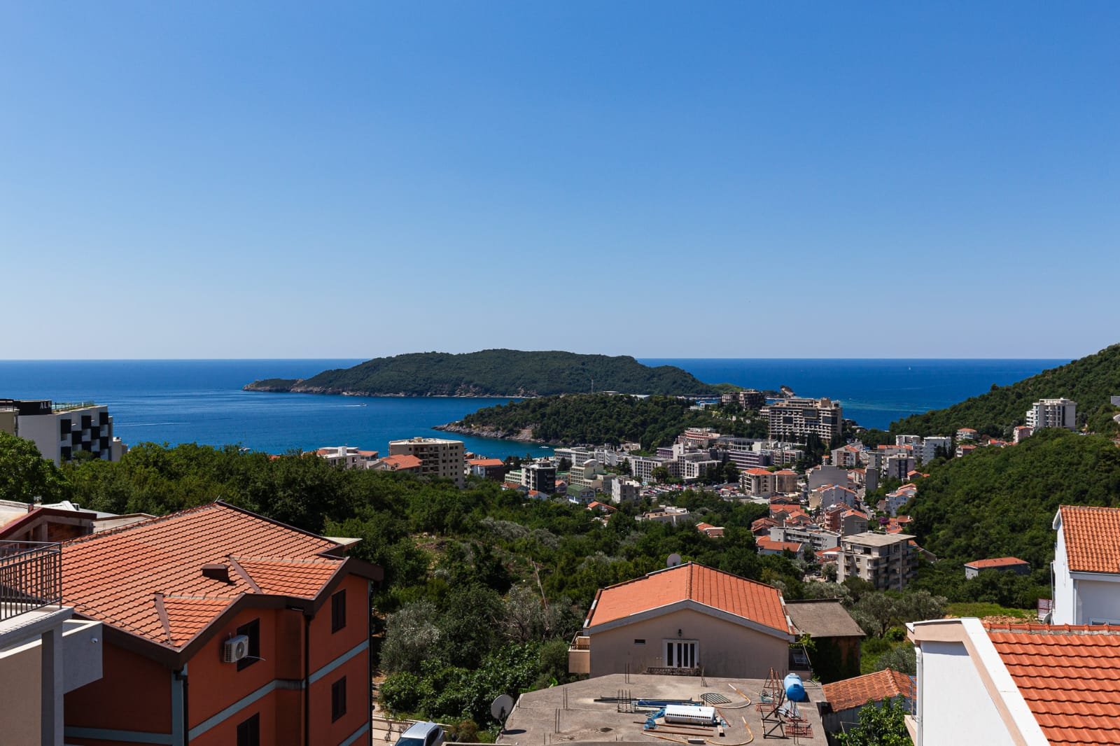 Premium Ulcinj real estate: red-roofed homes, lush hills, and Adriatic views&mdash;exclusive from immorenta.me by ekosphere doo.