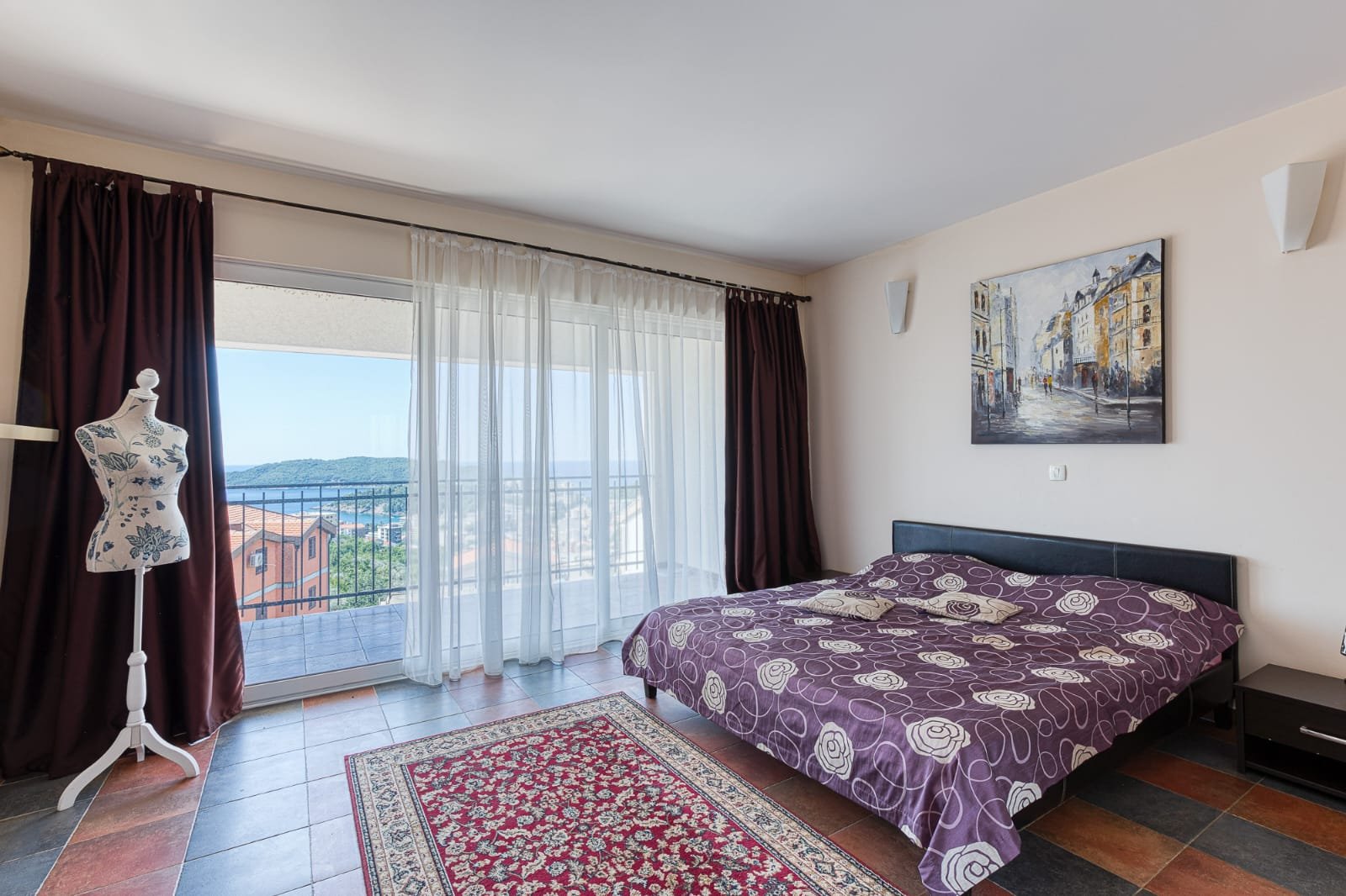 Elegant Ulcinj bedroom with double bed, modern decor, full-length windows, private balcony&mdash;prime real estate via immorenta.me.