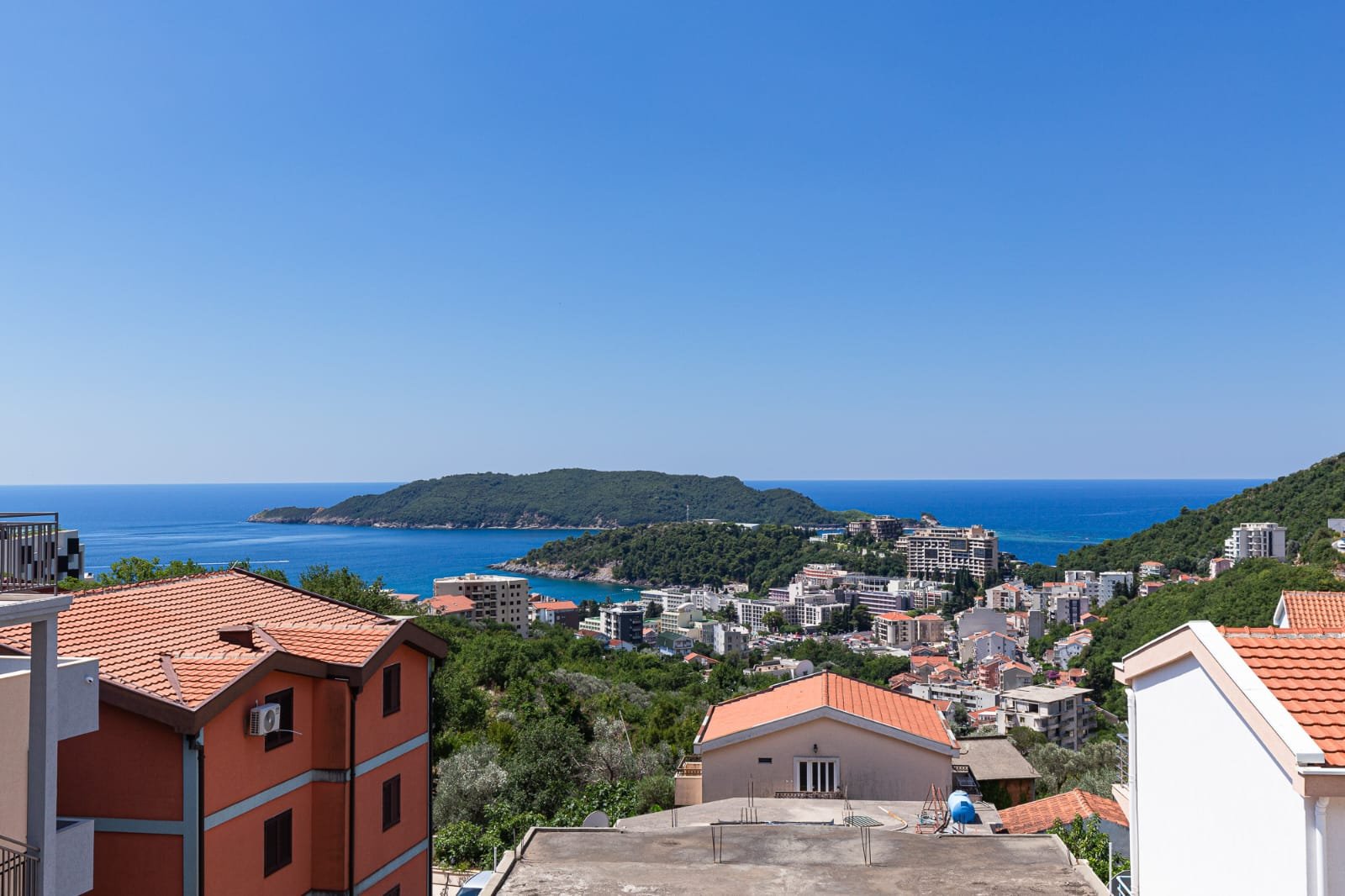 Stunning Ulcinj coastal homes with red roofs, lush hills, and Adriatic views&mdash;prime Montenegro property by ekosphere doo.