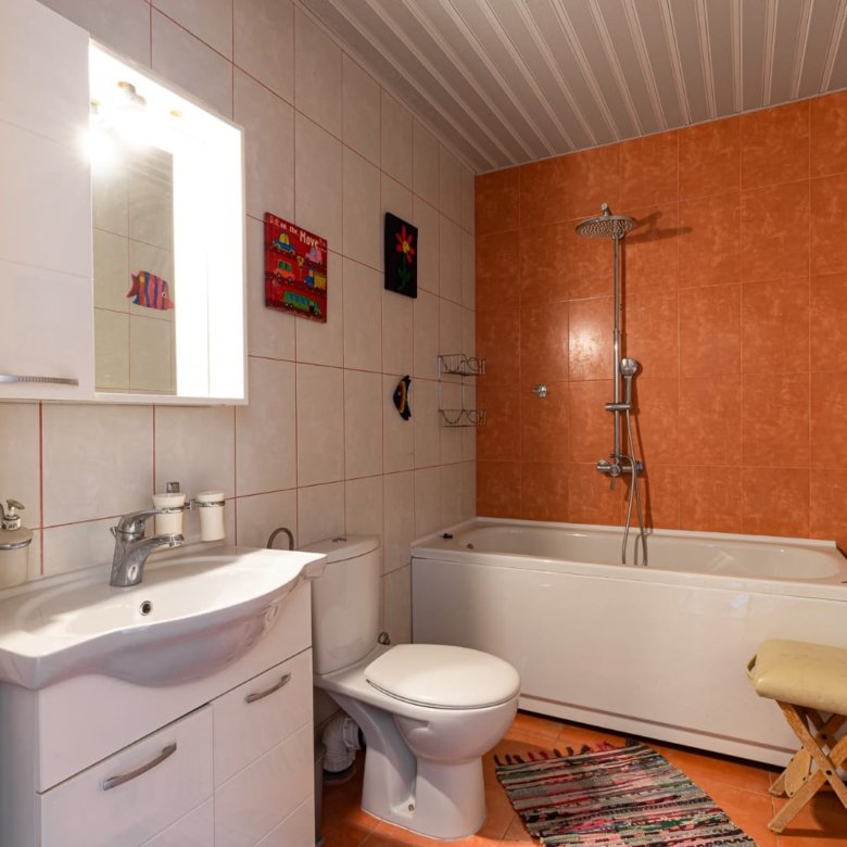 Modern tiled bathroom in Ulcinj with sleek fixtures, vibrant decor, perfect for investment on immorenta.me by ekosphere doo.