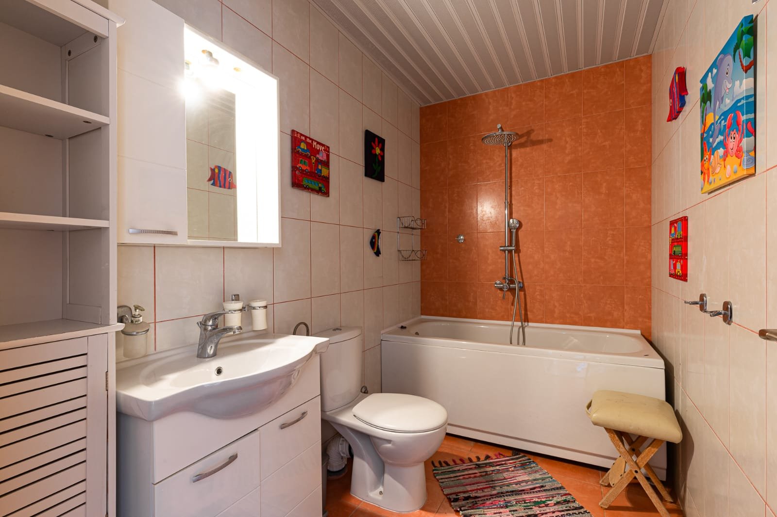 Modern tiled bathroom in Ulcinj with sleek fixtures, vibrant decor, perfect for investment on immorenta.me by ekosphere doo.