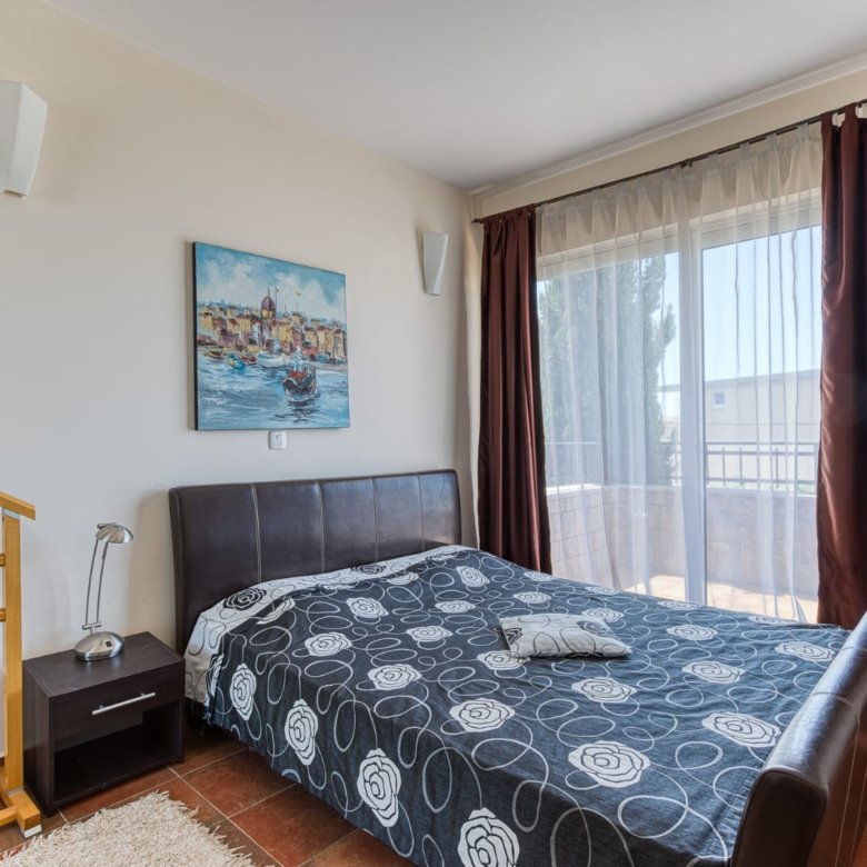 Elegant Ulcinj bedroom with balcony access, stylish finishes&mdash;ideal Montenegro investment. Exclusive at immorenta.me (ekosphere doo).