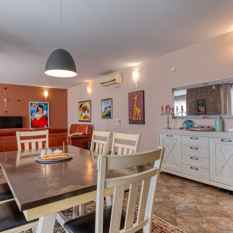 Spacious Ulcinj apartment: elegant dining area, modern furnishings, and stylish living room&mdash;ideal Montenegro investment by ekosphere doo.