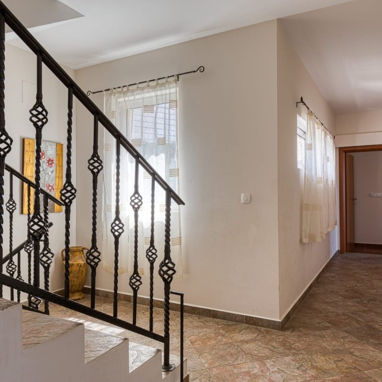 Elegant hallway with tiled floors, decorative staircase, and modern finishes&mdash;prime Ulcinj investment by ekosphere doo at immorenta.me.
