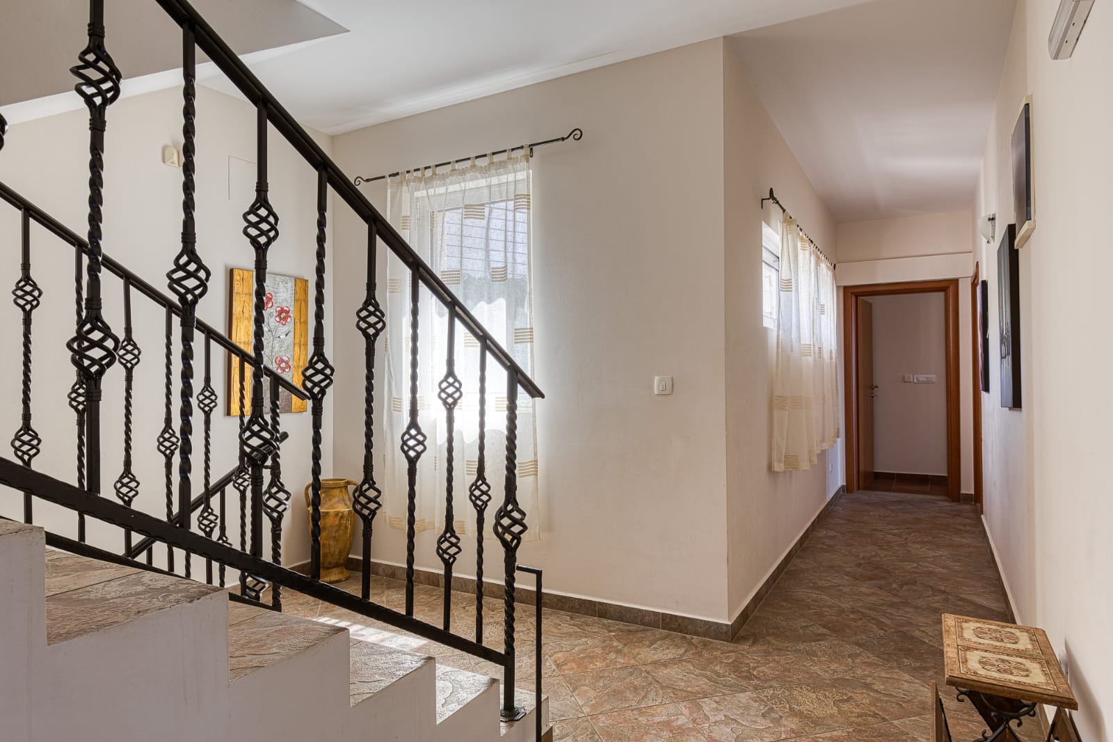 Elegant hallway with tiled floors, decorative staircase, and modern finishes&mdash;prime Ulcinj investment by ekosphere doo at immorenta.me.