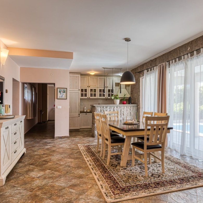 Elegant Ulcinj apartment: spacious dining area, modern kitchen, premium finishes&mdash;ideal Montenegro investment. By ekosphere doo.