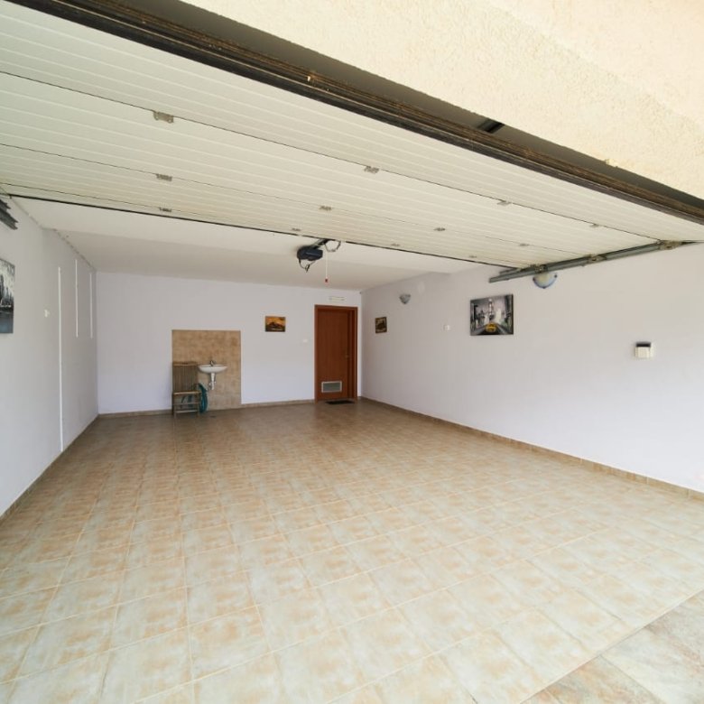 Spacious tiled garage in Ulcinj, Montenegro, ideal for secure parking or storage. Exclusive property at immorenta.me.