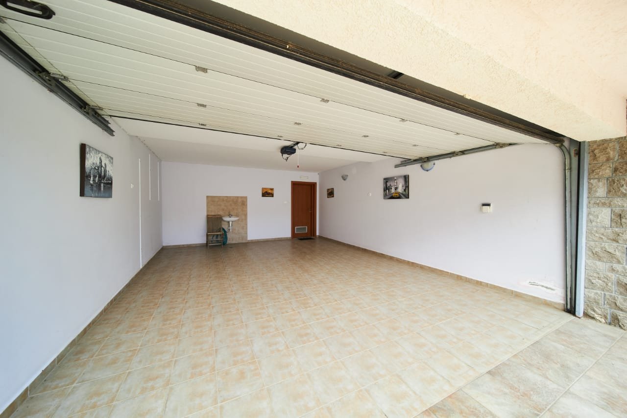 Spacious tiled garage in Ulcinj, Montenegro, ideal for secure parking or storage. Exclusive property at immorenta.me.