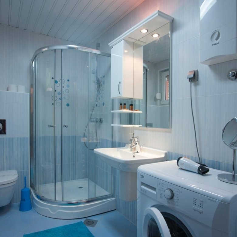 Stylish bathroom in Ulcinj, Montenegro with light blue tiles, modern fixtures, ideal for investors. immorenta.me by ekosphere doo.