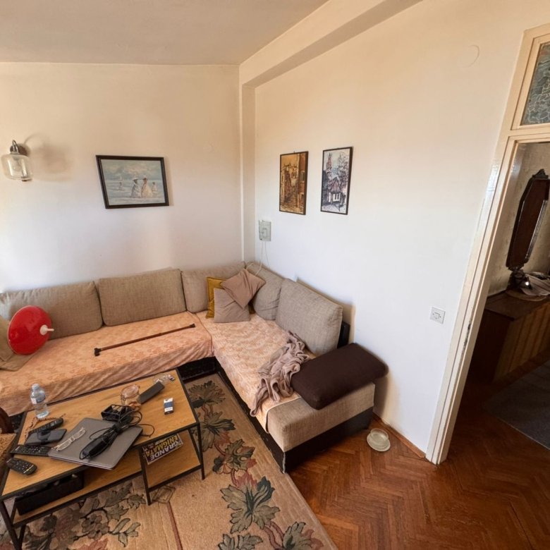 Elegant Ulcinj living room with modern corner sofa, stylish d&eacute;cor, and hallway; ideal Montenegro investment at immorenta.me.