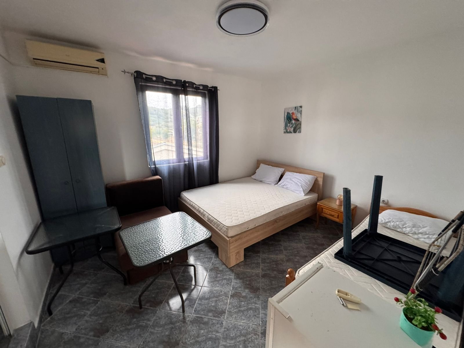 Bright Ulcinj bedroom with double and single beds, AC, wardrobe; investment-ready. Exclusive on immorenta.me by ekosphere doo.