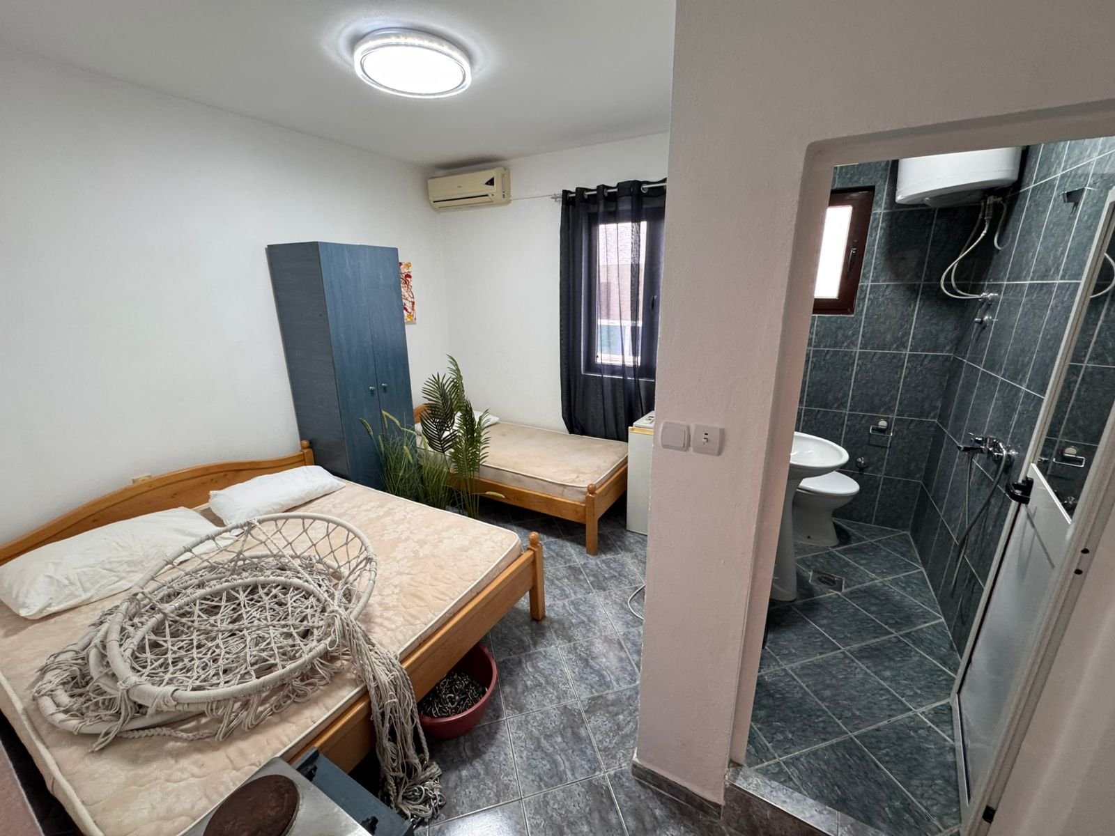 Charming Ulcinj bedroom: 2 beds, wardrobe, tiled floors, en suite bath. Great Montenegro investment via immorenta.me by ekosphere doo.