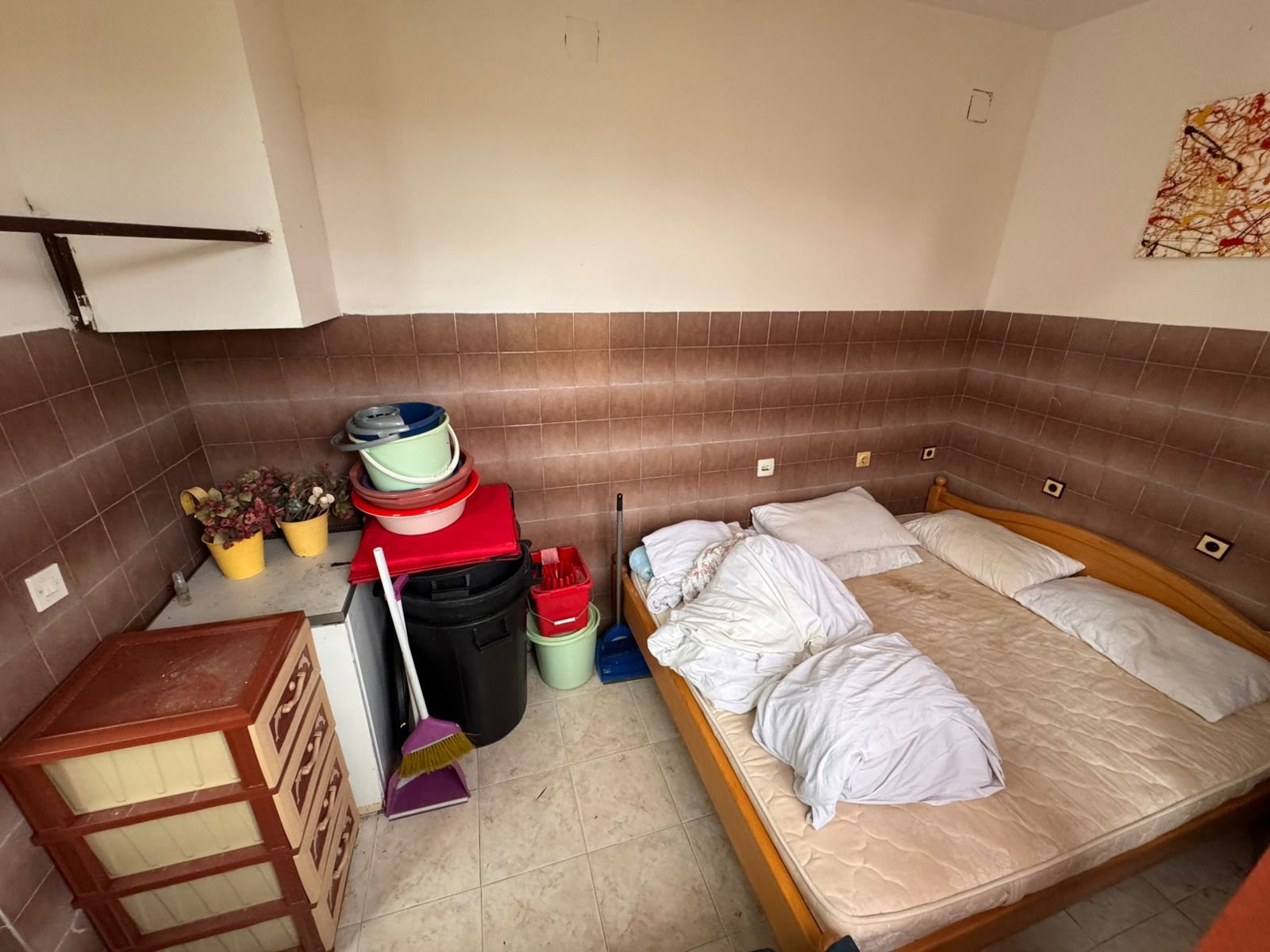 Charming Ulcinj investment: cozy tiled room with double bed, storage, and potential. Listed by immorenta.me, ekosphere doo.