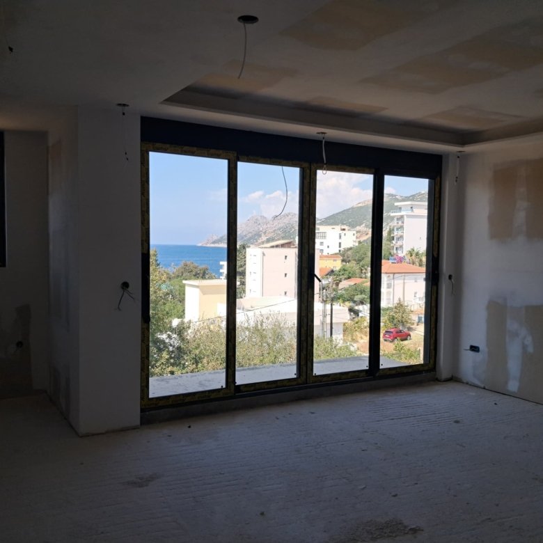 Spacious unfinished room with panoramic floor-to-ceiling windows, stunning sea and mountain views in Ulcinj. Exclusive at immorenta.me by ekosphere doo.