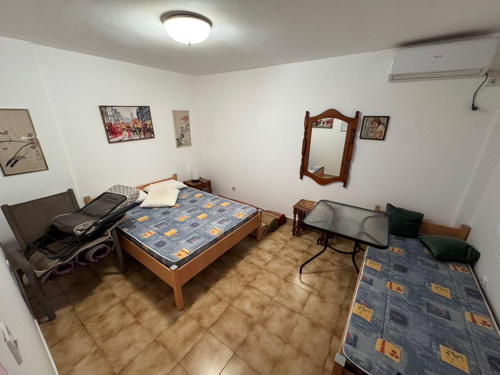 Charming tiled bedroom in Ulcinj with double and single beds, AC, elegant furnishings&mdash;ideal Montenegro real estate investment, by ekosphere doo.