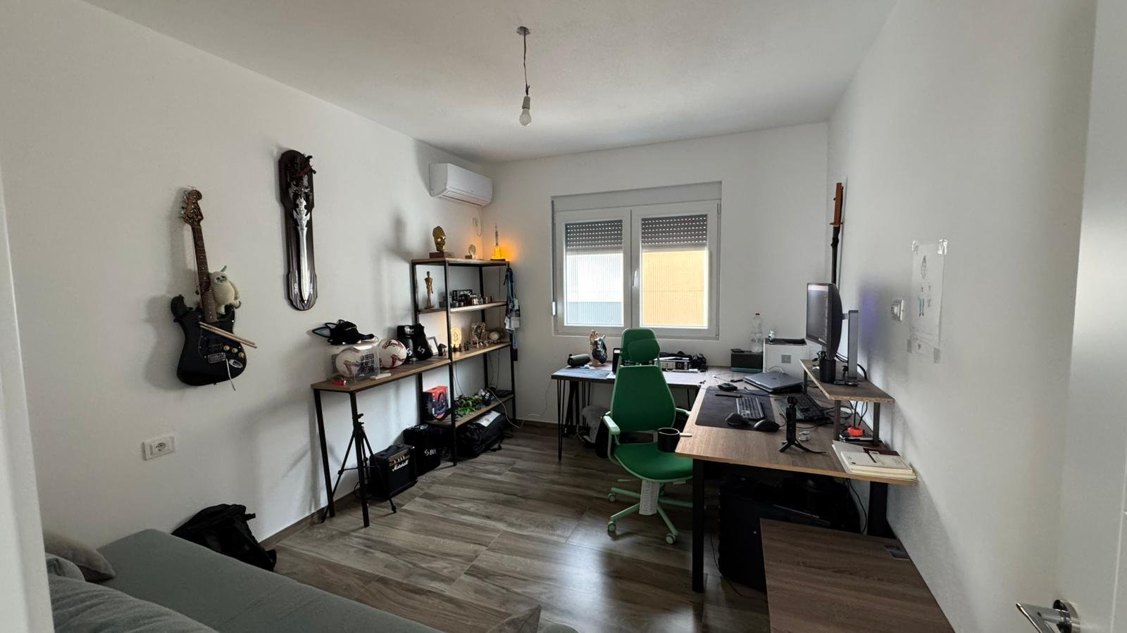 Modern Ulcinj home office with natural light, wood floors, premium desk&mdash;ideal Montenegro investment on immorenta.me by ekosphere doo.