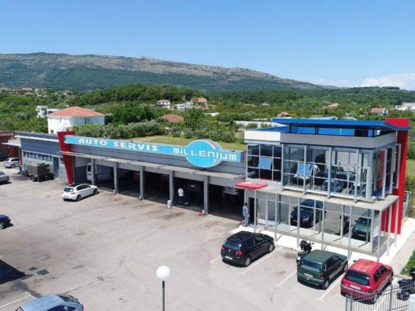 Prime commercial property in Ulcinj: modern auto service center, glass frontage, service bays, parking, mountain views&mdash;invest via immorenta.me, a project of ekosphere doo.