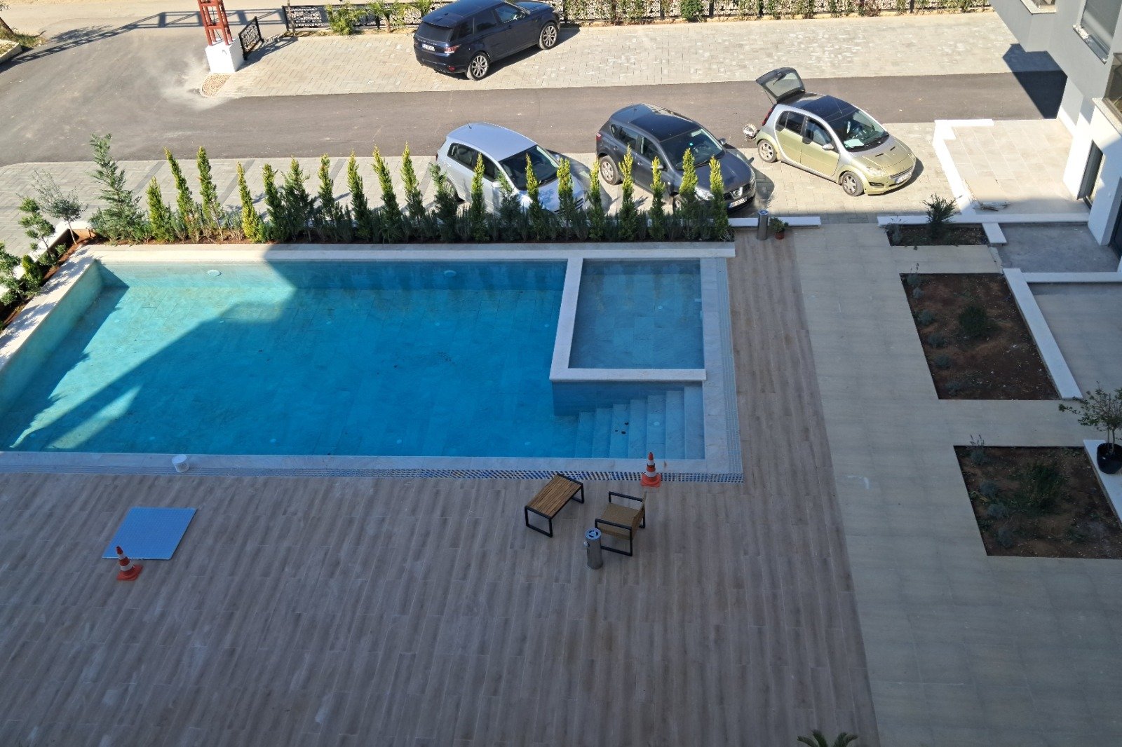 Luxury Ulcinj real estate: tiled patio, twin pools, stylish seating. Secure parking & privacy. immorenta.me by ekosphere doo.