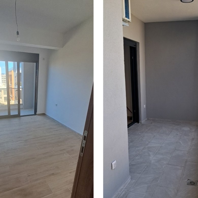 Modern Ulcinj apartment offers a bright, unfurnished room with wooden floors, large windows, and a tiled balcony boasting city views.