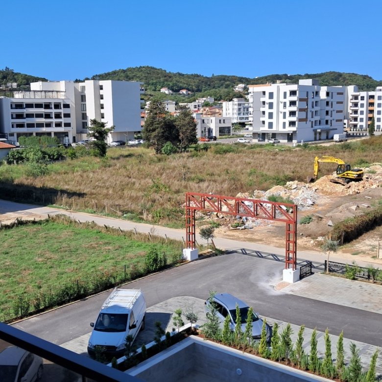 Prime Ulcinj property: New apartments rising amid hills, modern builds, and clear skies. Montenegro-listings.me by ekosphere doo.