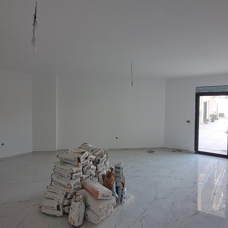 Bright, modern room in Ulcinj, Montenegro with marble floors and glass doors&mdash;prime investment on immorenta.me by ekosphere doo.
