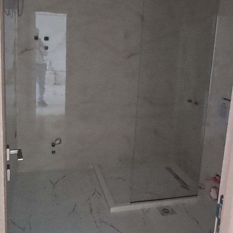 Modern bathroom in progress with elegant marble-style finishes and walk-in shower&mdash;prime Ulcinj investment at immorenta.me.