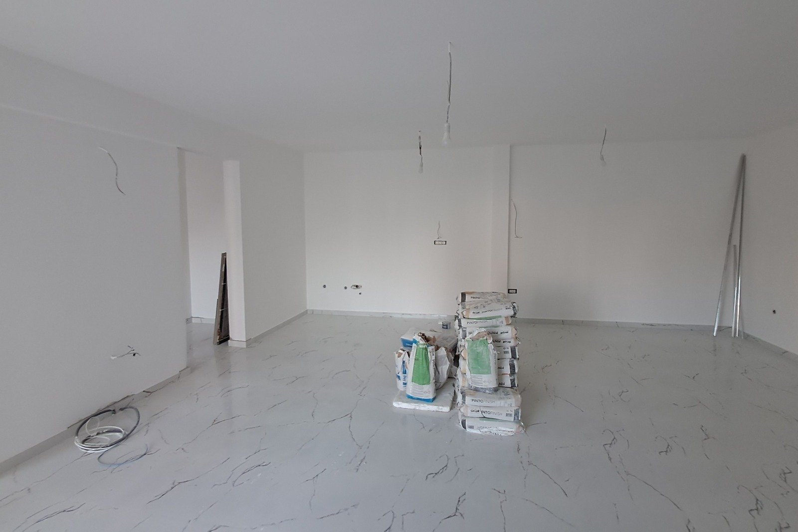 Spacious Ulcinj property under renovation with white walls, stylish flooring, and investment potential&mdash;immorenta.me by ekosphere doo.