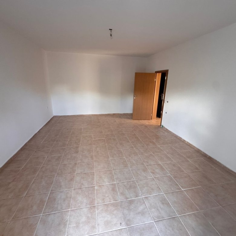 Spacious, sunlit room with elegant beige tiles and crisp white walls&mdash;ideal Ulcinj investment property from ekosphere doo on immorenta.me.