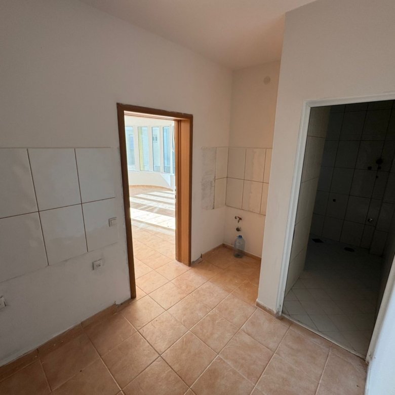 Bright, modern tiled space with beige floors, large sunlit windows; ideal Ulcinj investment on immorenta.me by ekosphere doo.