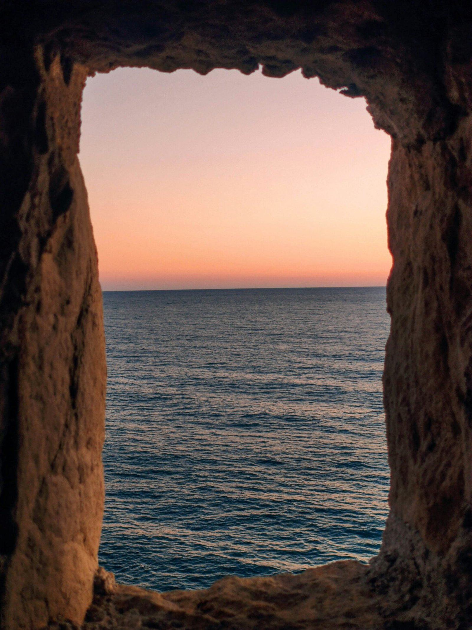 Contact Us - Ulcinj sunset ocean view framed by natural rock&mdash;invest in Montenegro real estate with immorenta.me by ekosphere doo.