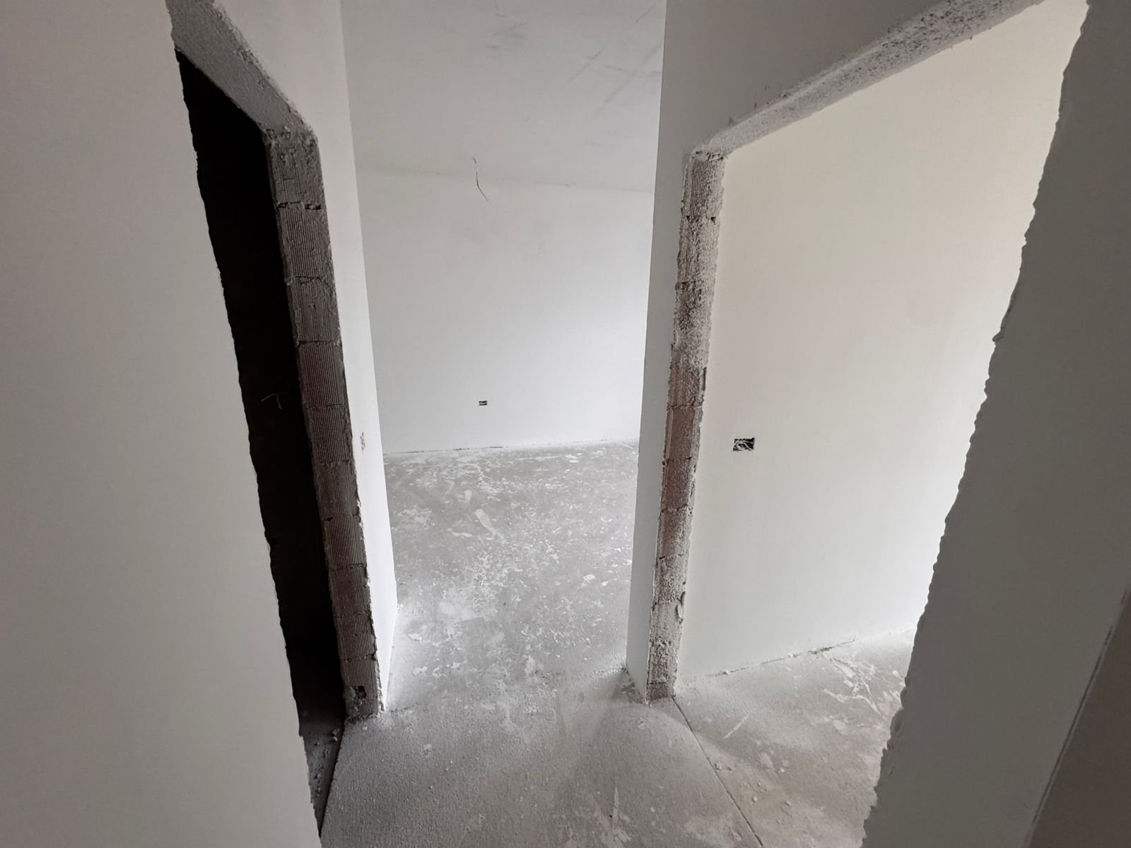 Invest in Ulcinj, Montenegro! Spacious unfinished interiors with white walls and open doorways&mdash;exclusive at immorenta.me by ekosphere doo.