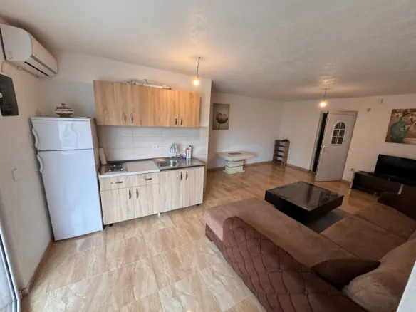 Stunning Ulcinj apartment: tiled floors, modern kitchen, spacious brown sectional&mdash;top investment via immorenta.me by ekosphere doo.