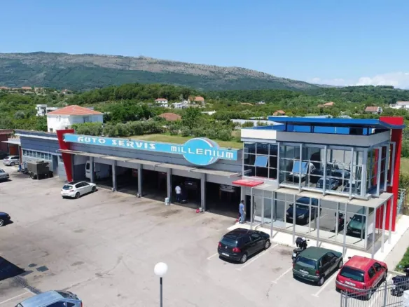 Prime commercial property in Ulcinj: modern auto service center, glass frontage, service bays, parking, mountain views&mdash;invest via immorenta.me, a project of ekosphere doo.
